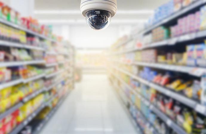 cctv security camera operating in retail store blur background